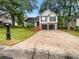 Charming two-story home with a two-car garage and a well-manicured front yard at 5021 Rodrick Trce, Marietta, GA 30066