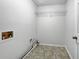 Functional laundry room with essential hookups and storage shelves at 5021 Rodrick Trce, Marietta, GA 30066