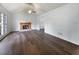 Bright living room featuring hardwood floors, fireplace, and large windows at 5021 Rodrick Trce, Marietta, GA 30066