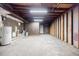 Unfinished basement offering exposed beams, concrete floors, wood frame construction, and a water heater at 766 Brian Ln, Forest Park, GA 30297
