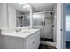 Updated bathroom showcases modern vanity, double sinks, and sleek glass enclosed shower at 766 Brian Ln, Forest Park, GA 30297