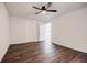 Large bedroom featuring two closets, dark wood-look floors, and bright natural light at 766 Brian Ln, Forest Park, GA 30297