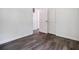 Bedrooom showcases wood-look flooring, neutral paint, and closet at 766 Brian Ln, Forest Park, GA 30297