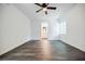 Bright bedroom boasts modern ceiling fan, wood-look floors, and leads to updated bathroom at 766 Brian Ln, Forest Park, GA 30297