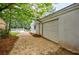 Attached garage featuring a large garage door and a gravel driveway at 766 Brian Ln, Forest Park, GA 30297