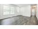 Sunlit living room showcasing new floors and white walls, offering a bright and modern feel at 766 Brian Ln, Forest Park, GA 30297