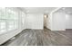 Inviting living room with large window, new floors, and plenty of natural light, creating a warm ambiance at 766 Brian Ln, Forest Park, GA 30297