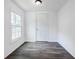 Bright and airy room with fresh paint, new floors, and a window overlooking the peaceful backyard at 766 Brian Ln, Forest Park, GA 30297