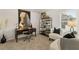 A comfortable home office features a modern desk, chair, and accent seating with shelving at 113 Maplewood Ln, Conyers, GA 30094