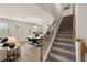 Open floorplan showcases the living room, stairs, and dining area with modern decor at 113 Maplewood Ln, Conyers, GA 30094