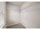 A walk-in closet features wire shelving and is adjacent to a window, which offers natural light at 113 Maplewood Ln, Conyers, GA 30094