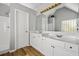 Bright bathroom featuring a walk-in shower, wood-look flooring, and a double vanity at 507 Mirramont Pl, Woodstock, GA 30189