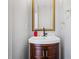 Bathroom with corner sink, decorative mirror and towel rack at 507 Mirramont Pl, Woodstock, GA 30189