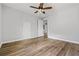 Bedroom with wood floors, ceiling fan, closet and neutral walls at 507 Mirramont Pl, Woodstock, GA 30189