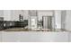 Kitchen features granite countertops, stainless steel appliances, and white cabinets at 507 Mirramont Pl, Woodstock, GA 30189