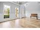 Inviting living room with hardwood floors, a light gray color scheme, and windows at 507 Mirramont Pl, Woodstock, GA 30189