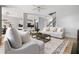 A living room is adjacent to the kitchen and features a fireplace and hardwood floors at 507 Mirramont Pl, Woodstock, GA 30189