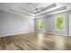 Spacious main bedroom with trey ceilings, ceiling fan and hardwood floors at 507 Mirramont Pl, Woodstock, GA 30189