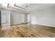 Large main bedroom with hardwood floors, recessed trey ceiling and two entry doors at 507 Mirramont Pl, Woodstock, GA 30189