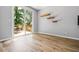 Bright room with access to an outdoor deck through sliding glass doors and floating shelves at 507 Mirramont Pl, Woodstock, GA 30189