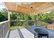Spacious covered deck with a wooded view, perfect for outdoor relaxation at 680 Harbor Point Ct, Lawrenceville, GA 30044