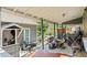 View of back porch with various storage items and wooded backyard at 680 Harbor Point Ct, Lawrenceville, GA 30044