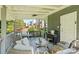 Back porch area featuring seating and a grill, great for outdoor entertaining at 680 Harbor Point Ct, Lawrenceville, GA 30044