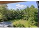 A lovely green backyard surrounded by tall trees offering privacy and serenity at 680 Harbor Point Ct, Lawrenceville, GA 30044