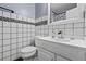 Bathroom featuring a tiled wall accent, sink and vanity at 680 Harbor Point Ct, Lawrenceville, GA 30044