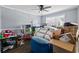 Bedroom, gray walls, hardwood floors, and a window with a backyard view offering a serene and inviting atmosphere at 680 Harbor Point Ct, Lawrenceville, GA 30044