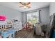Bedroom with natural light, ceiling fan and wood-look flooring at 680 Harbor Point Ct, Lawrenceville, GA 30044