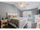 Bedroom featuring a window, soft gray walls, and wood-look floors at 680 Harbor Point Ct, Lawrenceville, GA 30044