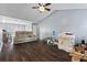 Spacious living room featuring hardwood floors, gray walls, vaulted ceiling, and a view of the upper level at 680 Harbor Point Ct, Lawrenceville, GA 30044