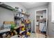 A walk-in pantry with ample shelving space and supplies, with a view of the kitchen beyond at 680 Harbor Point Ct, Lawrenceville, GA 30044
