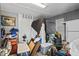 Interior view of a cluttered storage area with door and window at 680 Harbor Point Ct, Lawrenceville, GA 30044