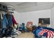 A storage room with clothes, bins, laundry and a TV for entertainment at 680 Harbor Point Ct, Lawrenceville, GA 30044
