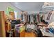 Walk-in closet with clothes and lots of storage spaces at 680 Harbor Point Ct, Lawrenceville, GA 30044