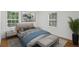Serene bedroom featuring neutral decor, hardwood floors, and ample natural light at 2130 Main Nw St, Atlanta, GA 30318
