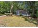 Beautifully maintained home featuring a covered front porch and well-manicured front yard at 2130 Main Nw St, Atlanta, GA 30318