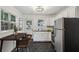 Bright, updated kitchen featuring white cabinets, dark countertops, and stainless steel appliances at 2130 Main Nw St, Atlanta, GA 30318