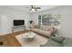 Cozy living room setup with large window, modern furniture, and hardwood floors at 2130 Main Nw St, Atlanta, GA 30318