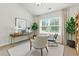 Bright home office with a large window, neutral decor, and ample natural light at 2445 Whitehead Place Dr, Suwanee, GA 30024