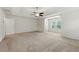 Spacious main bedroom features tray ceiling, carpet flooring, and ample natural light at 2445 Whitehead Place Dr, Suwanee, GA 30024