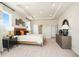 Large main bedroom featuring a tray ceiling, decorative furnishings, and ample space at 4034 Dantry Ln, Buford, GA 30519