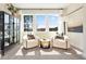 Sitting area with chairs, a table, and a large window offering natural light and a view at 4034 Dantry Ln, Buford, GA 30519