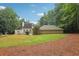 Wide view of the backyard and exterior of the home with well-kept landscaping at 434 Westlake Nw Dr, Marietta, GA 30064