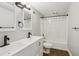 Bathroom with a double sink vanity, tub, shower, and modern fixtures at 434 Westlake Nw Dr, Marietta, GA 30064