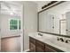 Bathroom featuring a double sink vanity and a doorway leading to bedroom at 434 Westlake Nw Dr, Marietta, GA 30064