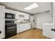 Kitchen with stainless steel appliances, white cabinetry, and modern finishes at 434 Westlake Nw Dr, Marietta, GA 30064