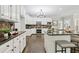 Kitchen view with dark countertops, stainless steel appliances, white cabinets, and hardwood floors at 434 Westlake Nw Dr, Marietta, GA 30064
